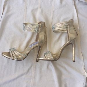 Gold open toe heels, with crystal detail.